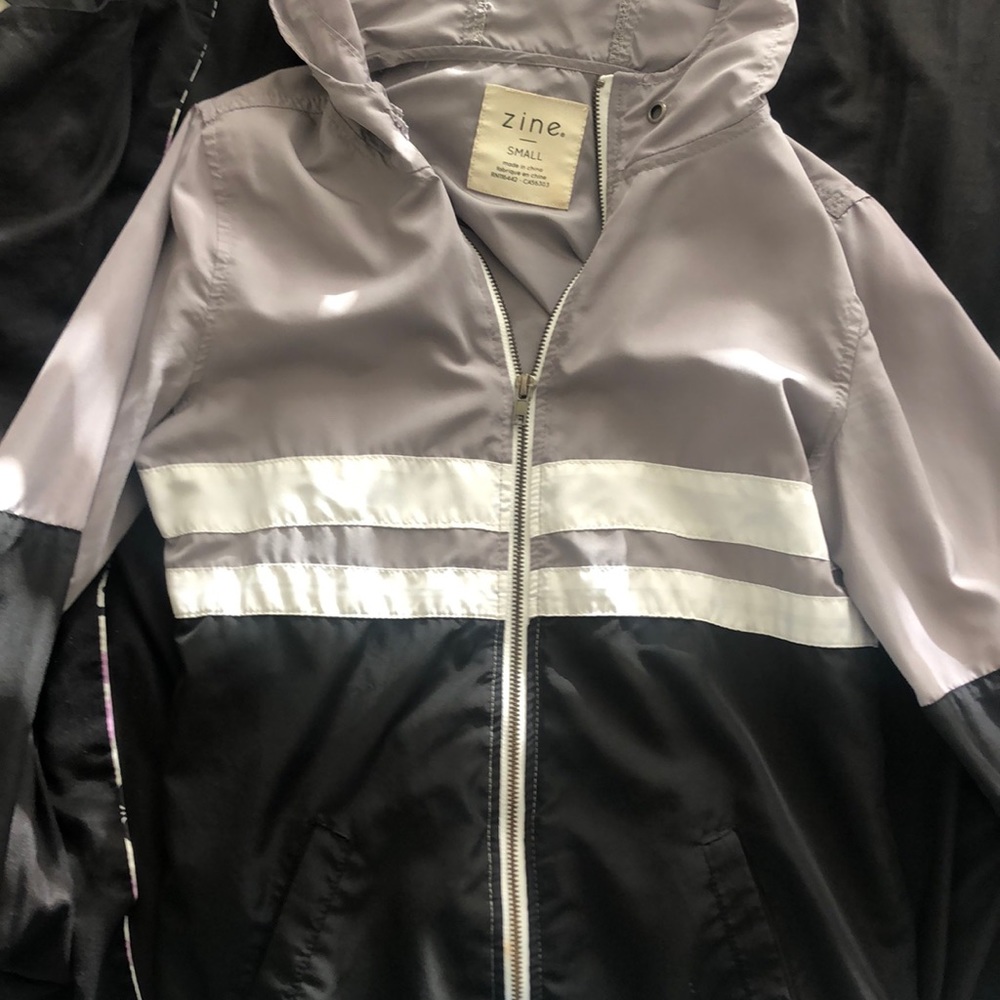 Black, grey, and white windbreaker